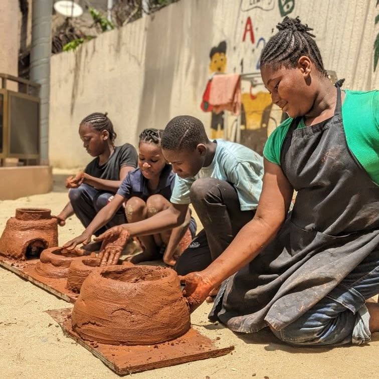 Child moulding clay in an art activity