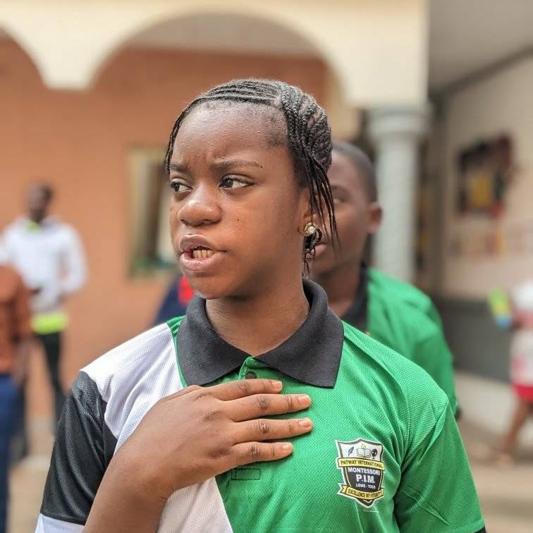 Pupil in green school uniform